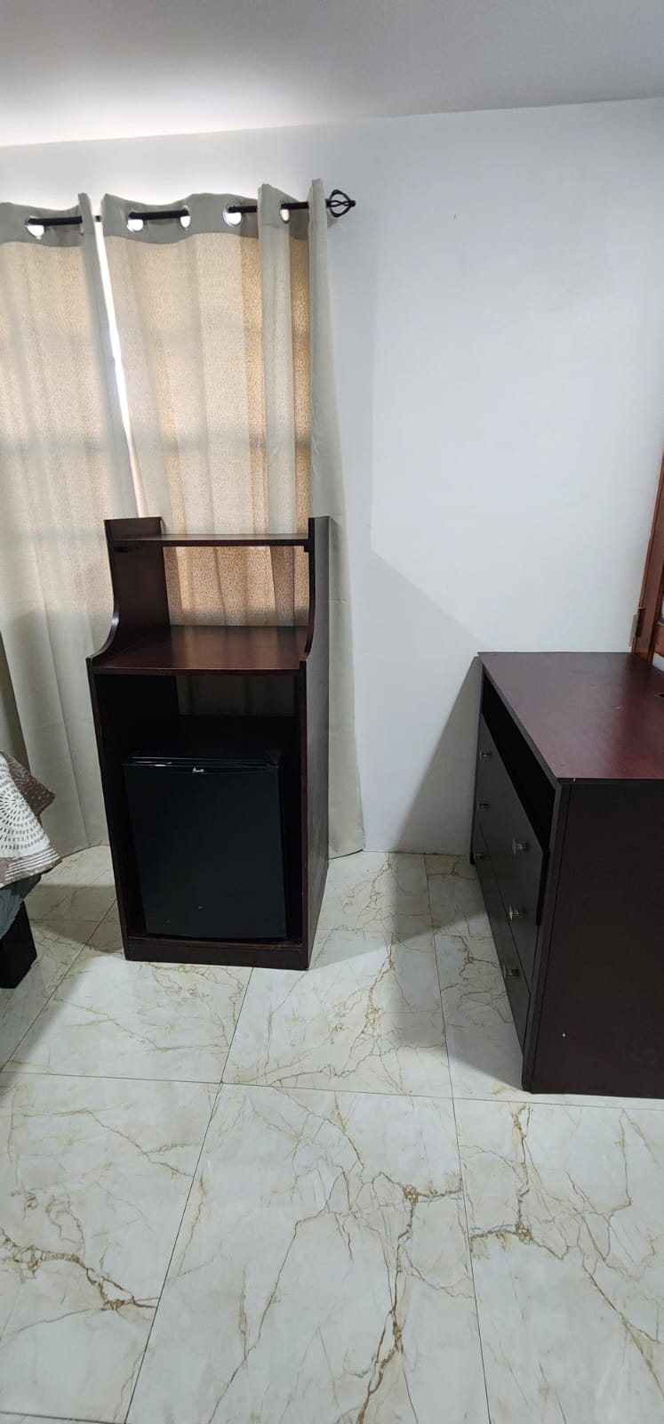 Bedroom with mini-fridge and microwave