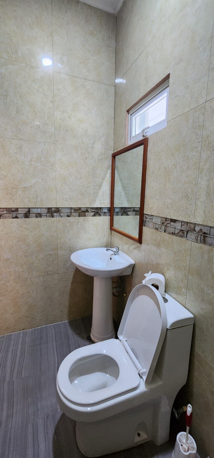 One-bedroom apartment bathroom vanity and toilet