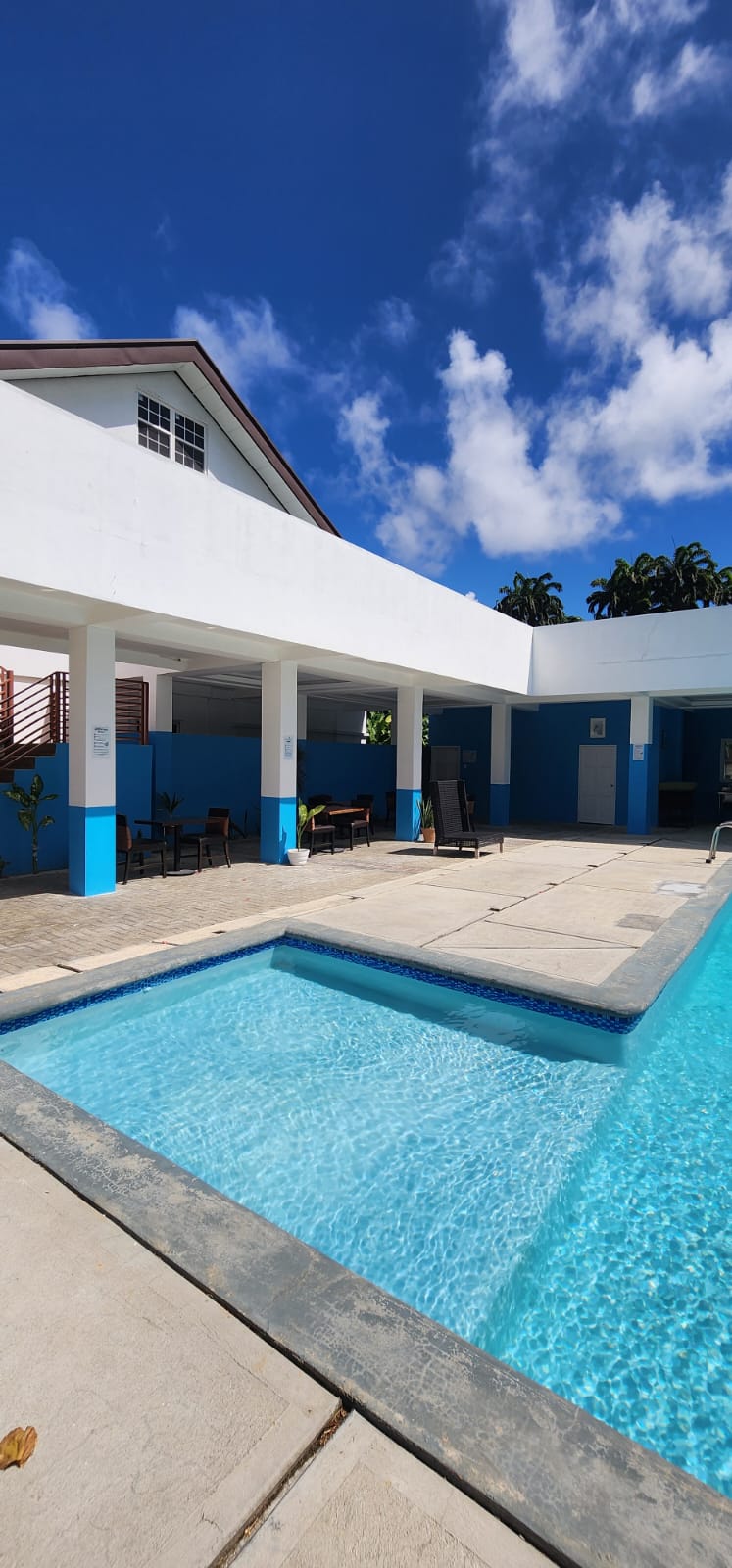 Pool, courtyard and covered seating area