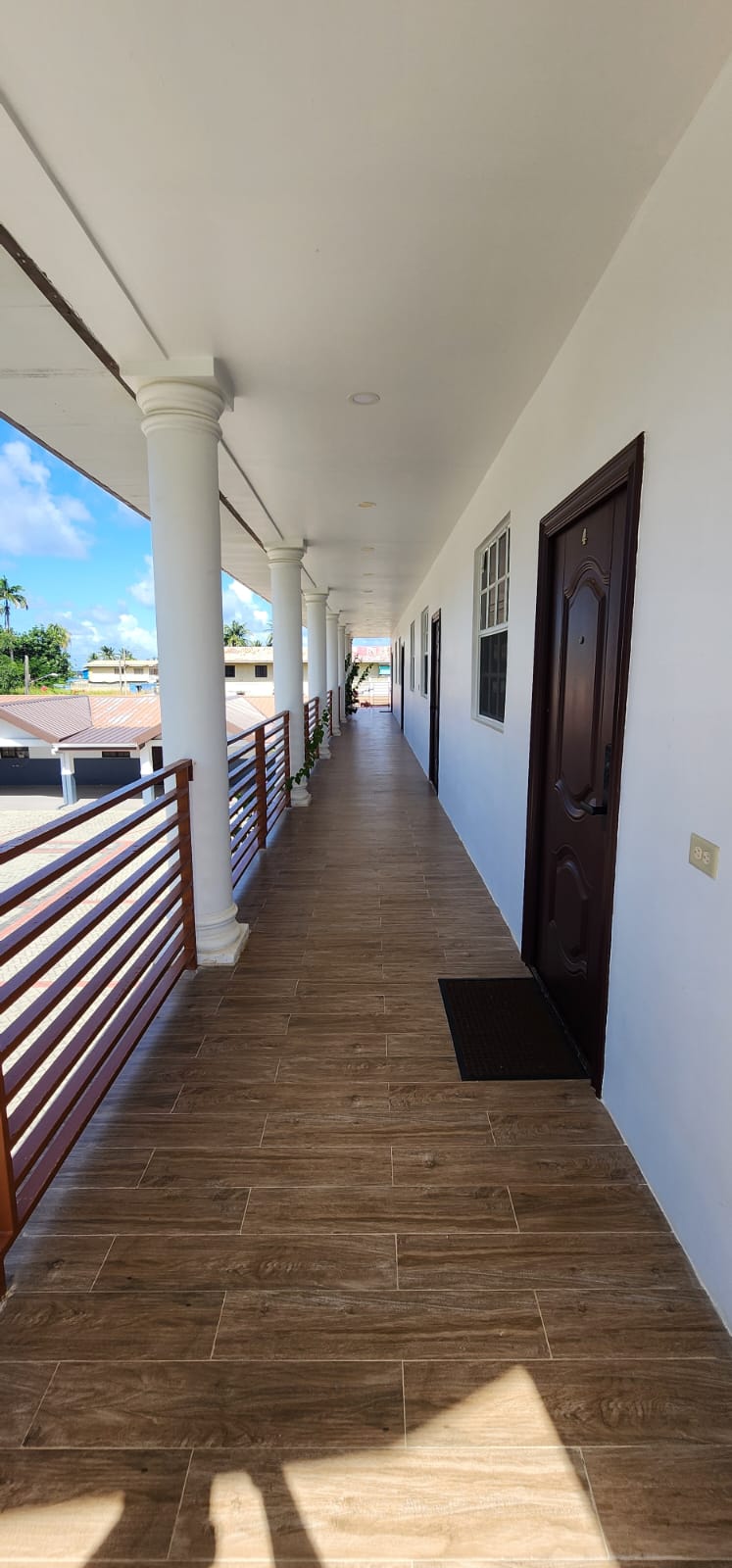 Covered upstairs corridor at Olympic Villas